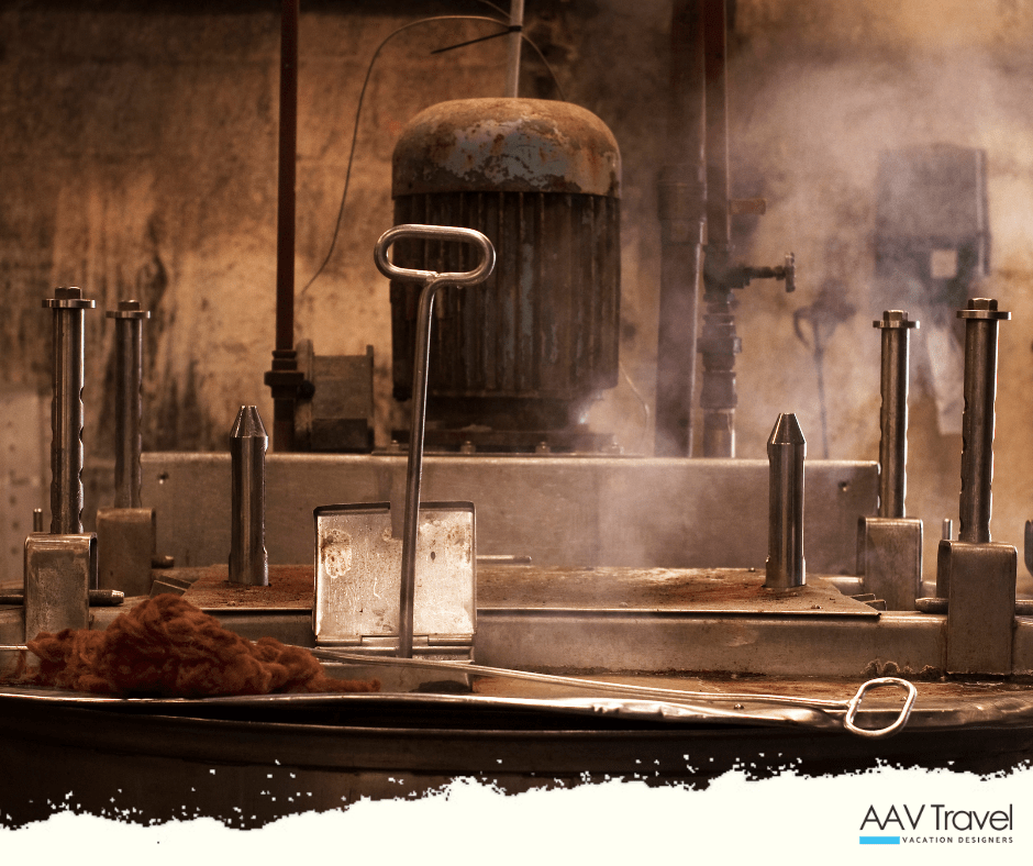 Weaver in the Outer Hebrides, Scotland, working on a traditional loom to create authentic Harris Tweed fabric—an iconic, handwoven textile protected by law and supported through responsible luxury travel experiences.