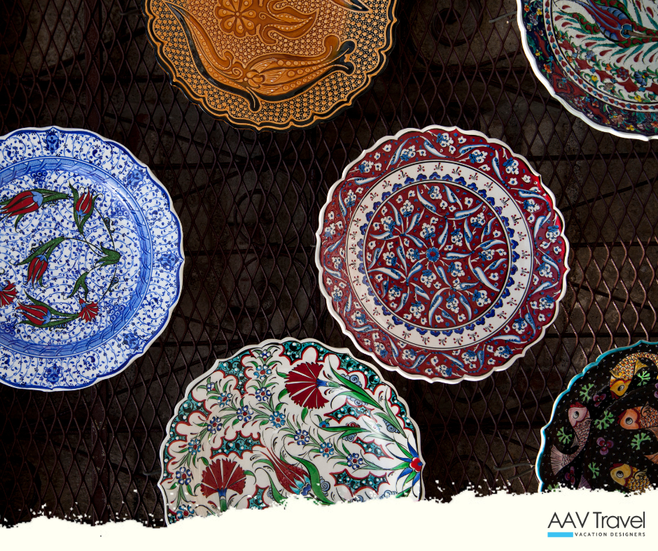 Turkish ceramic artist painting traditional Ottoman floral patterns onto Iznik pottery.